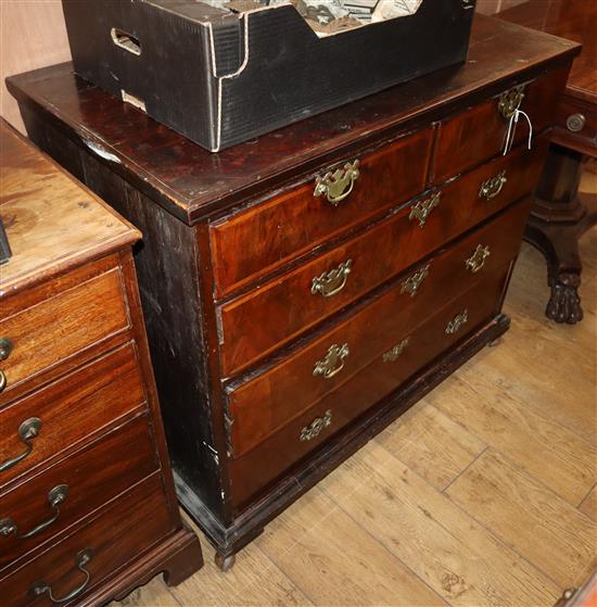 A George II walnut feather-banded chest fitted two short drawers and three graduated long drawers W.97cm